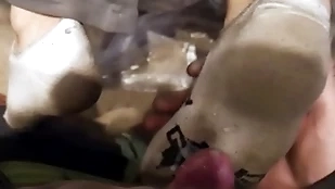 A handful of young guys calumnious socks footjob